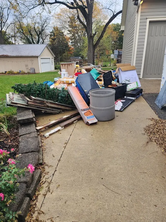 Dumpster being loaded with debris for Commercial Dumpster Rental in Martin